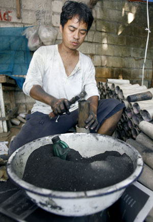 Chinese man working with gunpowder